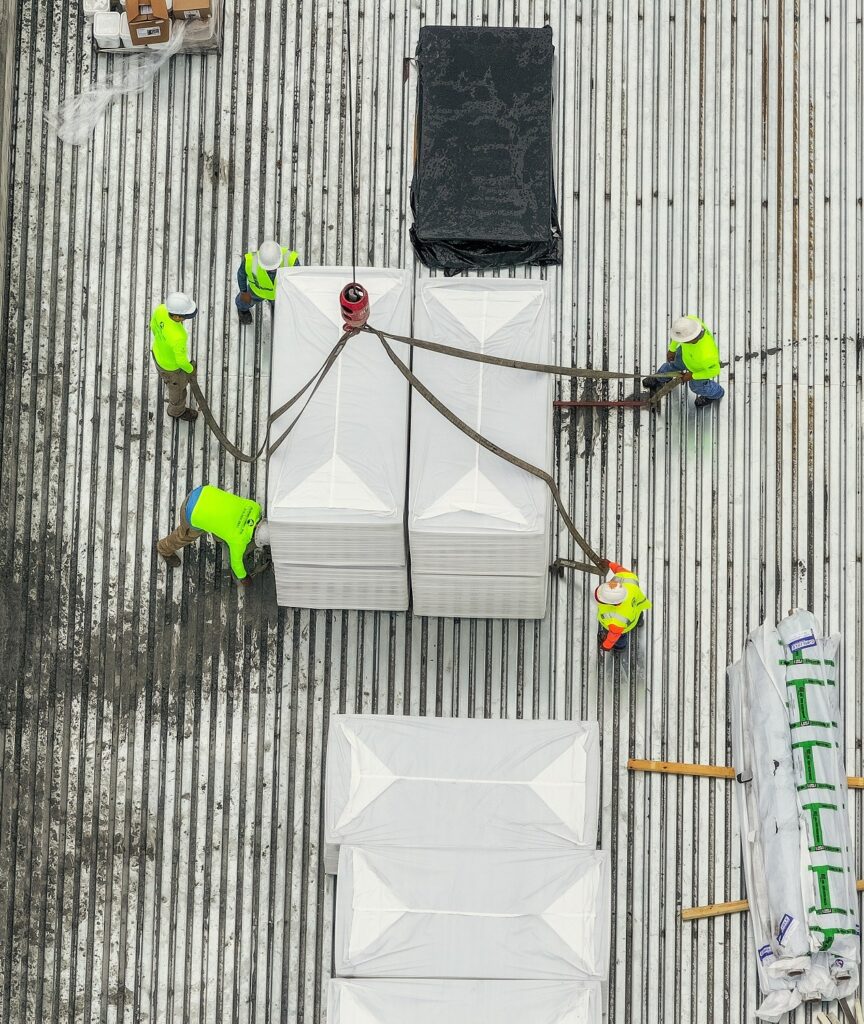 Flat white commercial rooftop with safety markers