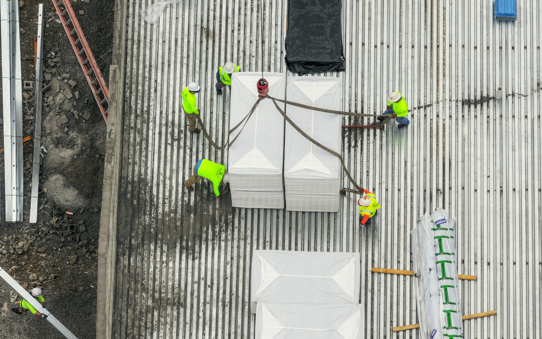 4 roofers on a commercial roof.